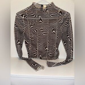 DIVIDED H&M sheer long-sleeve top with a black and white zebra print.